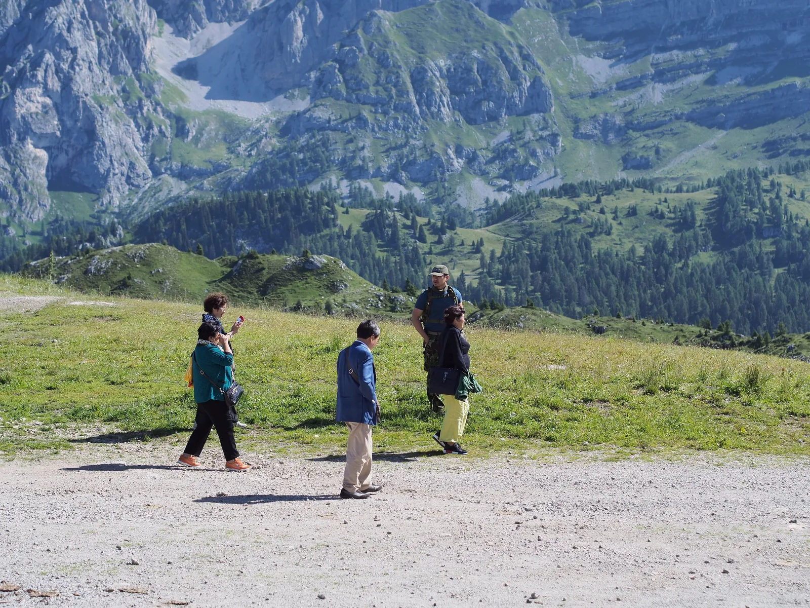 Walkers crossing the high plateau at Sass Pordoi