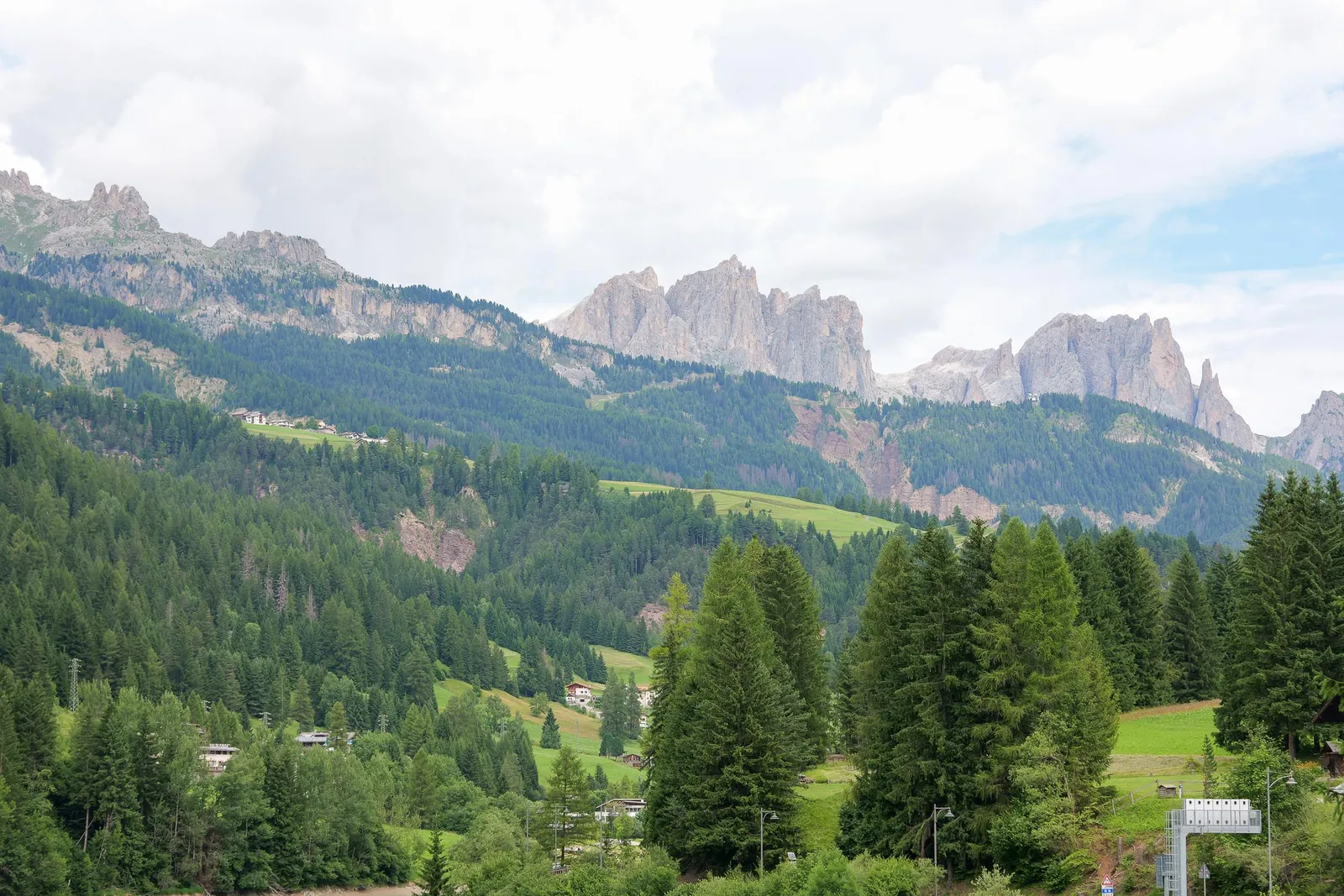 Forested Val di Fassa with the Catinaccio peaks on the skyline