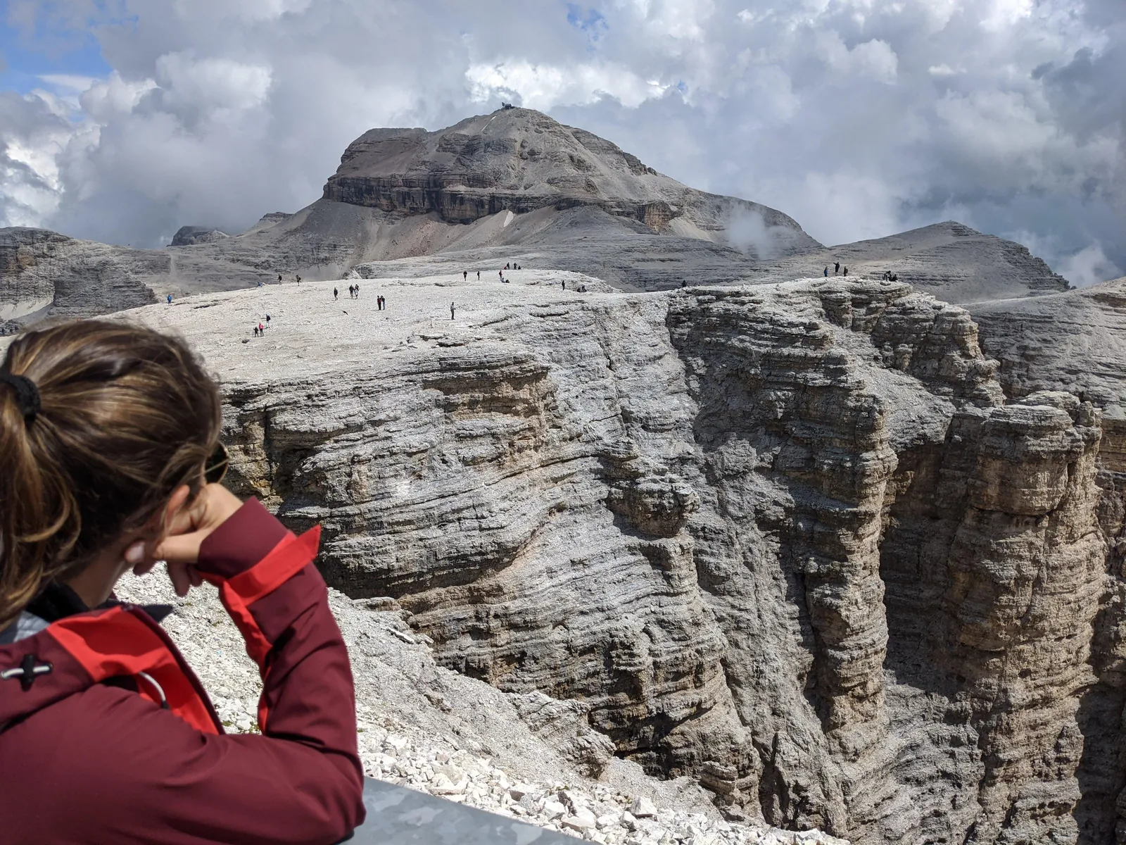 Photographer on the rim of the Sass Pordoi summit terrace