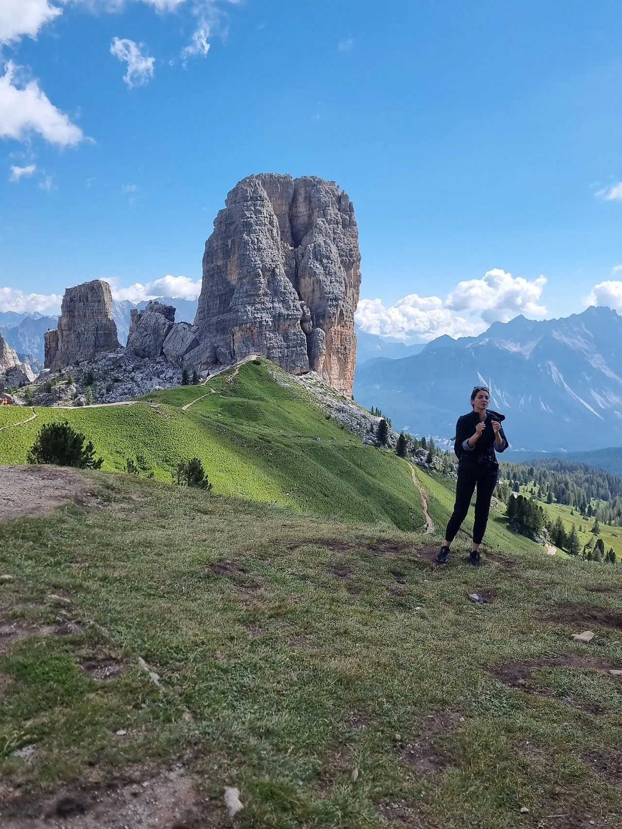 Hiker below the largest tower of the Cinque Torri