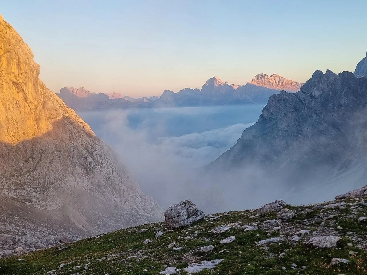 Morning cloud filling the valleys below the Cadini