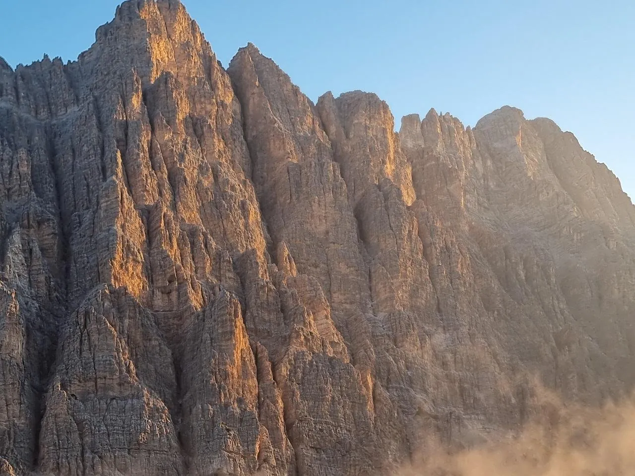 Warm light on a Dolomites rock face